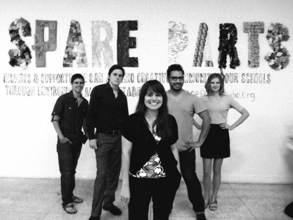 A black and white photograph of artist and arts administrator Mary Cantú with the Spare Parts team.