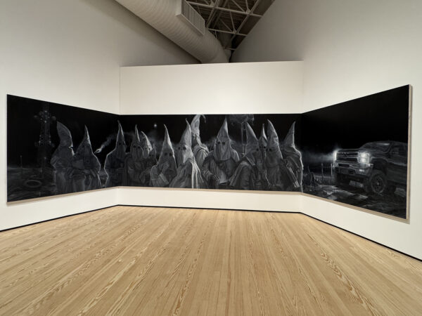 An installation image of paintings by Vincent Valdez.