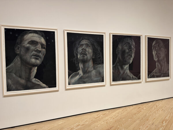 An installation image of four portaits by Vincent Valdez.