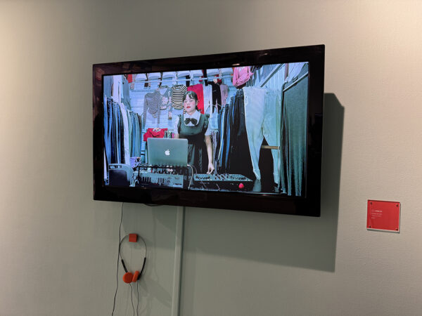 An installation image of a video documenting a DJ set by Conejx.