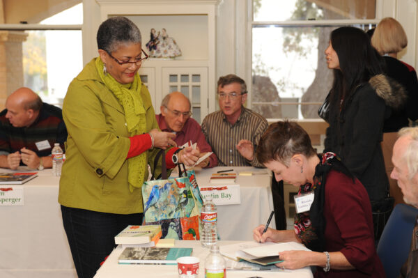 A photograph of people at a book fair.