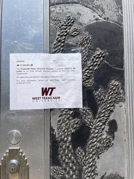 A photograph of a paper taped to the front of the Panhandle-Plains Historical Museum, indicating the closure of the museum.