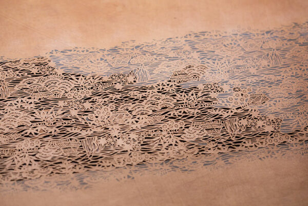 An intricately patterned stencil.