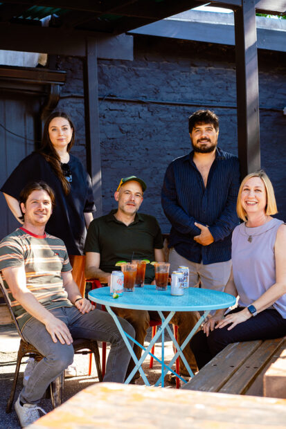 A photograph of Austin art gallerists Kevin Ivester, Jill McLennon, Phillip Niemeyer, Ricky Morales, and Jill Schroeder.